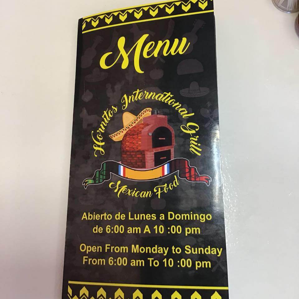 The image shows a black menu cover for 