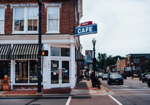 A street corner with a brick building housing 