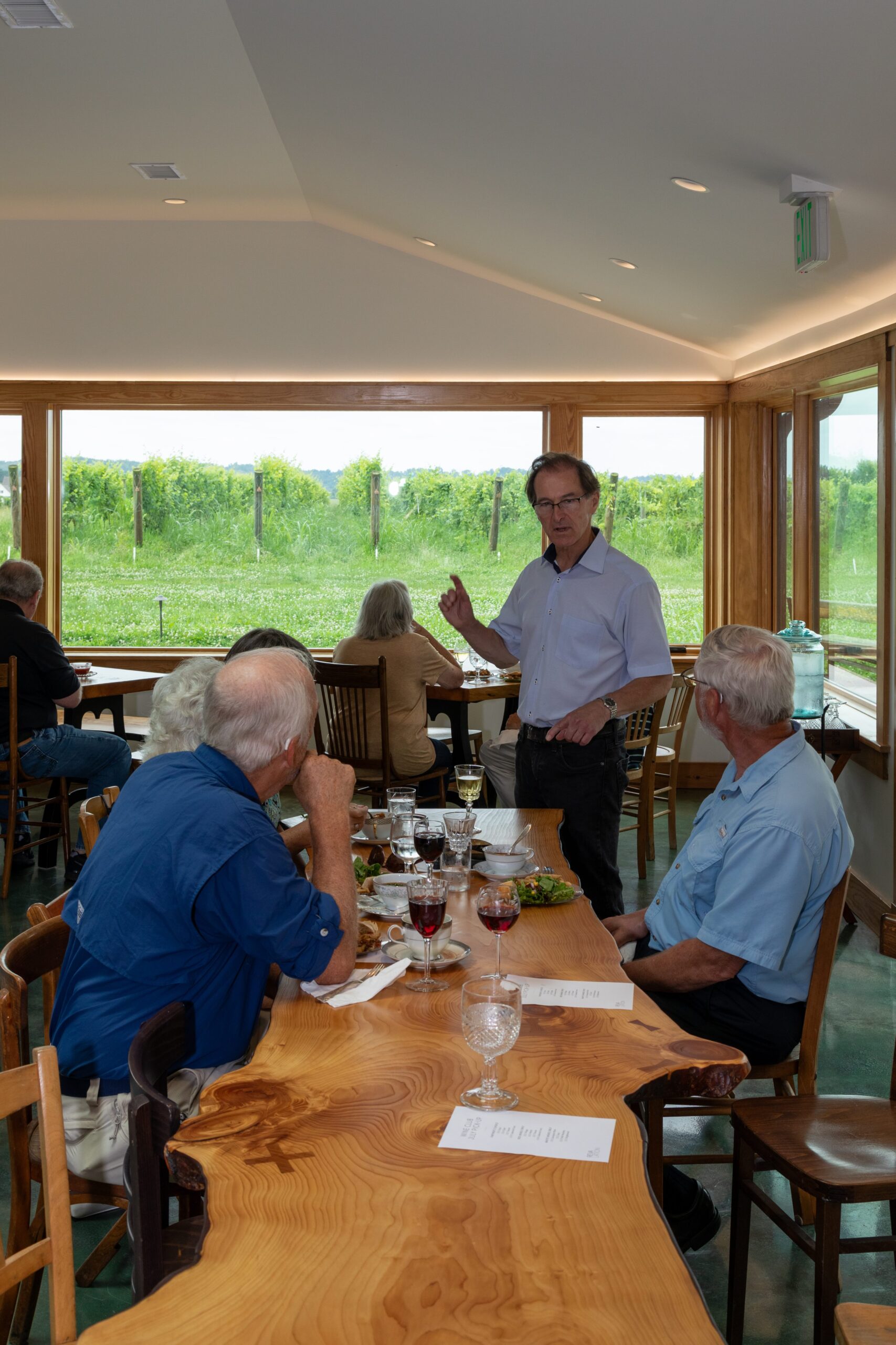 man speaking with customers