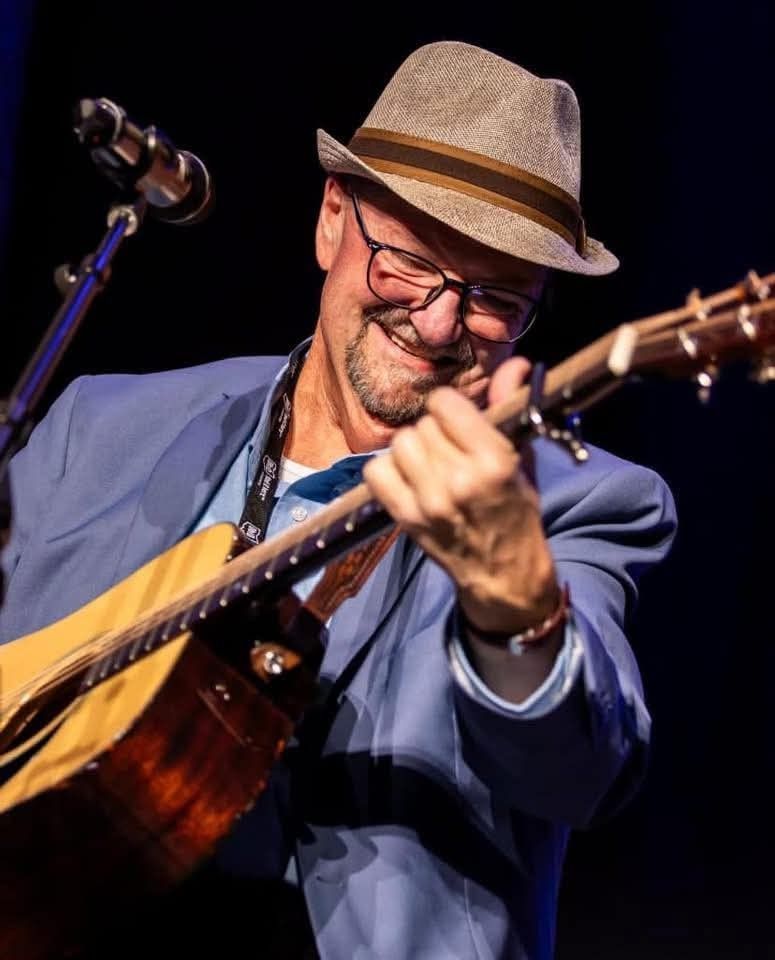 image of Danny Paisley holding a guitar