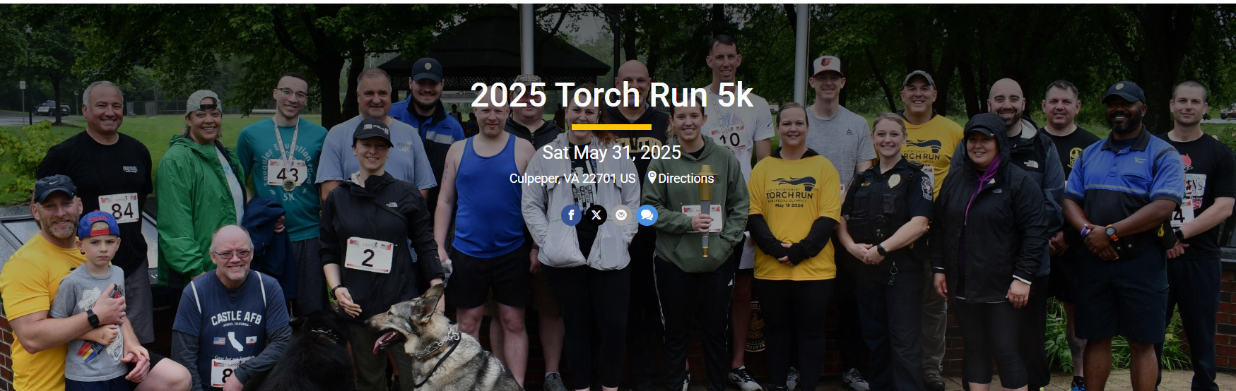 group of people with race bibs on and race metals