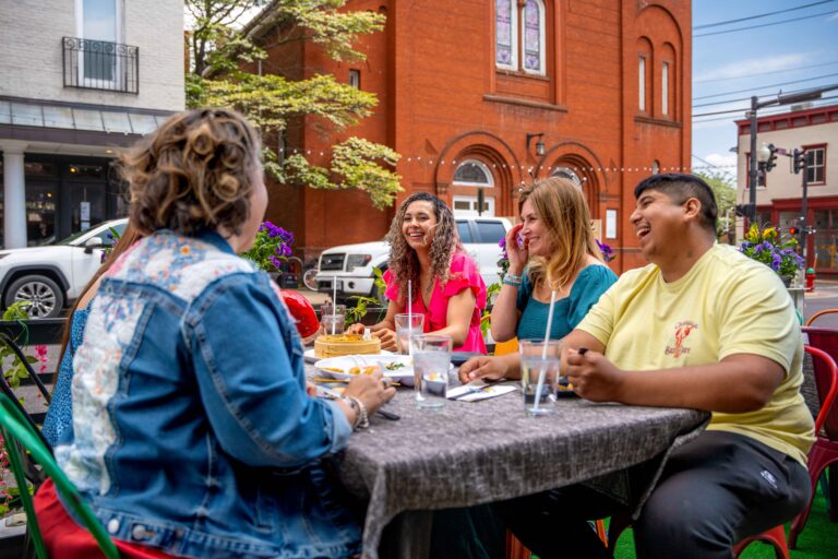 group of people laughing at a table