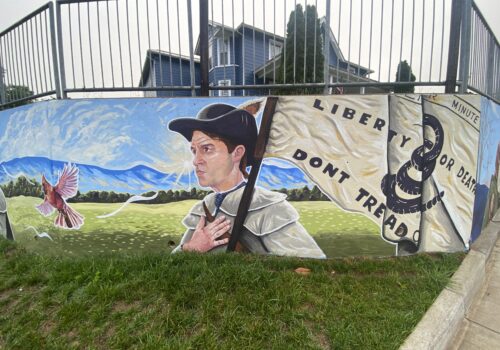 mural of a minuteman holding a Culpeper Minutemen flag Image